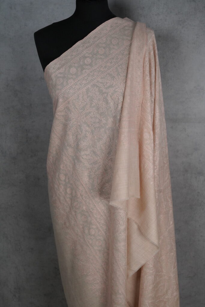 Chand-e-Dastak Handmade Shawl, a Pashmina Sozni Shawl in soft blush with intricate embroidery, embodying timeless elegance