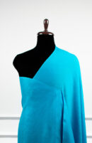 Bare Weave Shawls in sky, a wool silk shawl with plain weave design and a subtle sheen for elegant layering.
