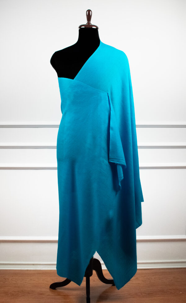 Bare Weave Shawls in sky, a wool silk shawl with plain weave design and a subtle sheen for elegant layering.