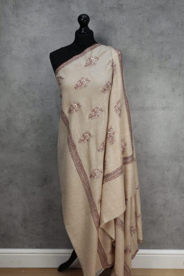 Gulnaaz Handmade Shawl, an Elegant Floral Pashmina Shawl Design in beige with blush embroidery, crafted with Sozni artistry