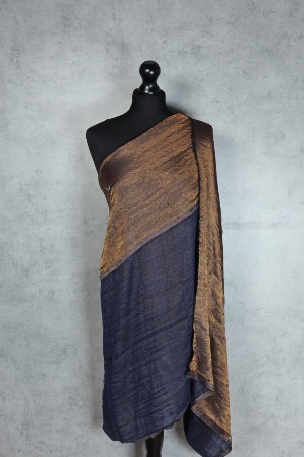 Moonlight Glow Shawl in Blue, an elegant evening shawl woven with 85% wool and 15% silk, featuring golden threads for subtle luxury.