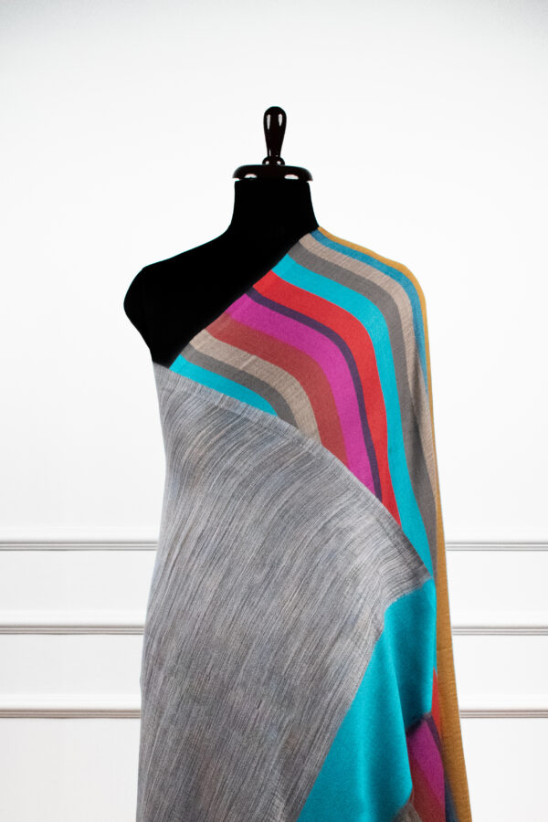 Reversible Stripes Shawl in Teal, a striped shawl featuring bold multicolored stripes and a subtle gradient, crafted from a wool and Tencel blend.
