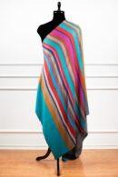 Reversible Stripes Shawl in Teal, a striped shawl featuring bold multicolored stripes and a subtle gradient, crafted from a wool and Tencel blend.