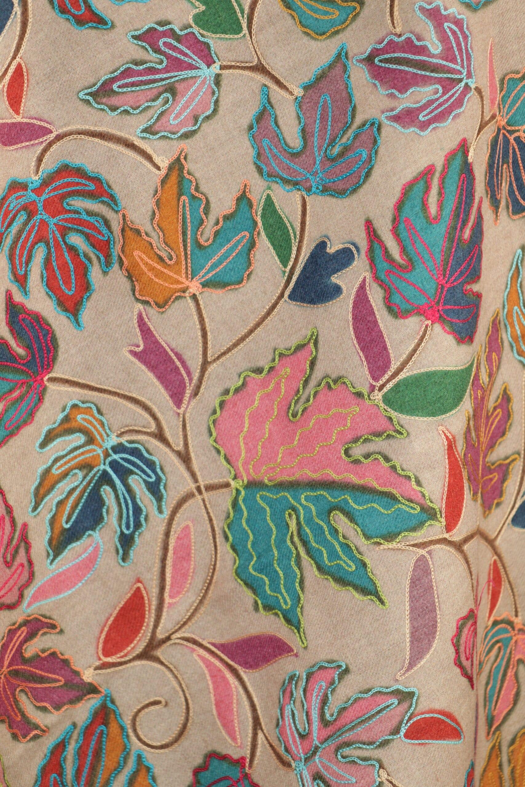 beige-1-scaled-600x900 Royal Crest Stole in beige crafted as a wool paisley stole with intricate embroidery and fluid texture.