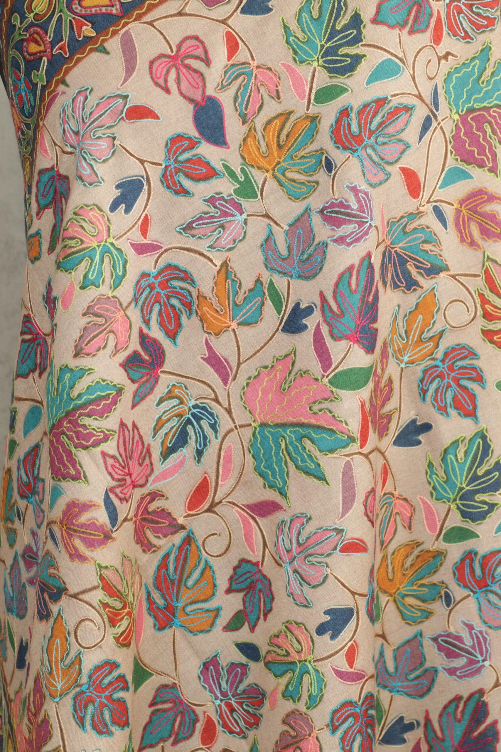 beige-2-scaled-600x900 Royal Crest Stole in beige crafted as a wool paisley stole with intricate embroidery and fluid texture.