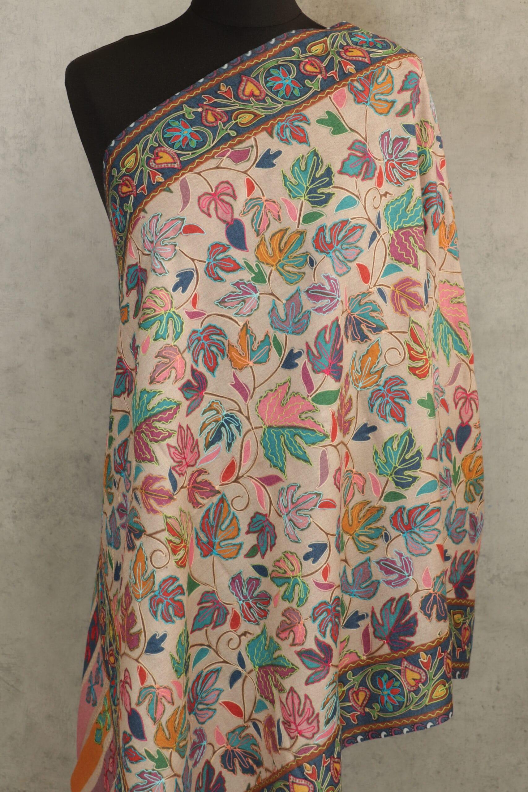 beige-3-scaled-600x900 Royal Crest Stole in beige crafted as a wool paisley stole with intricate embroidery and fluid texture.