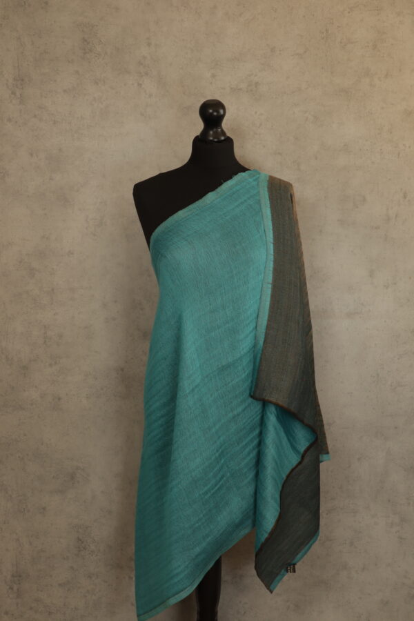 Moonlight Glow Stole in sky color, an evening stole with golden threads, crafted from a wool-silk blend, offering luxe glow.