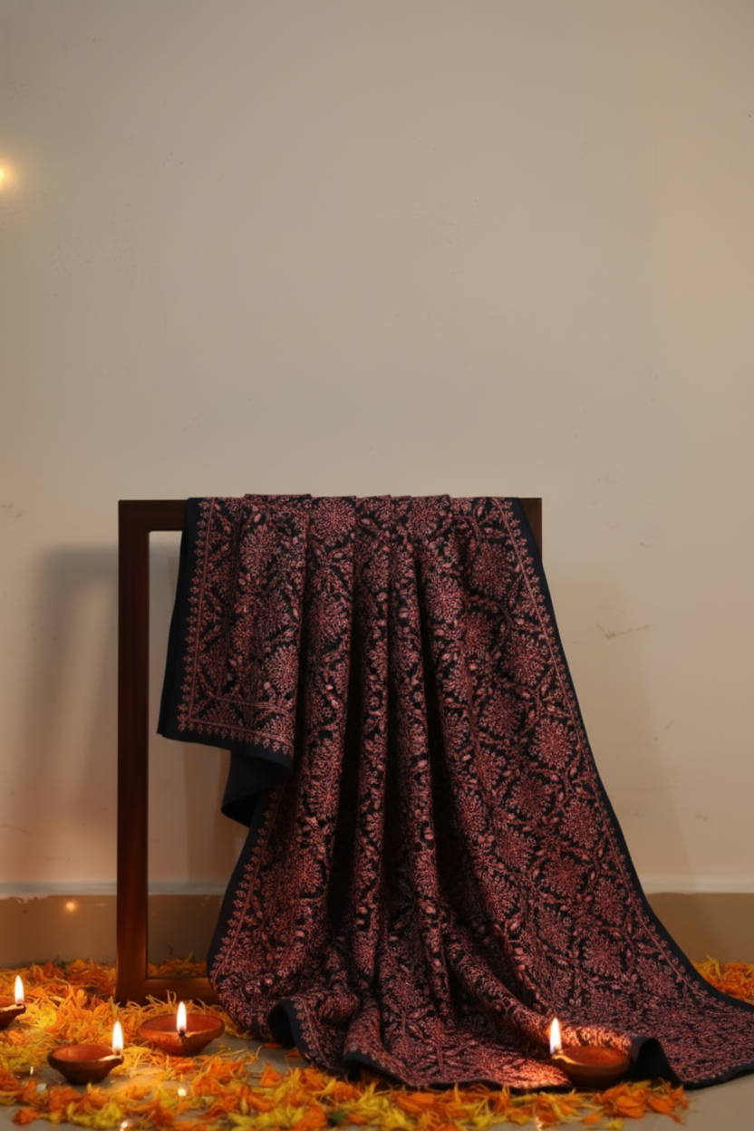 ember-bloom-scarf-from-the-luxury-diwali-gift-collection-displayed-on-a-wooden-stand- surrounded-by-lit-diwali-diyas-creating-a-warm-and-festive-ambiance