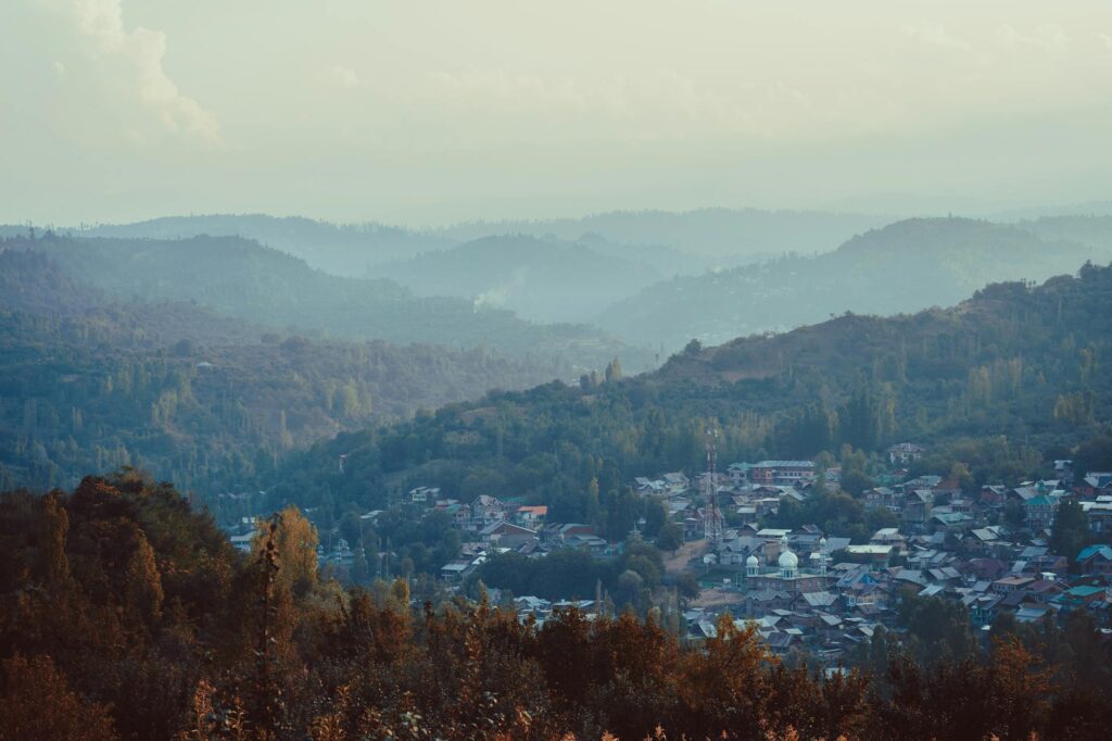 Mist lying in a mountain valley at dawn, the ridges fading into grey
